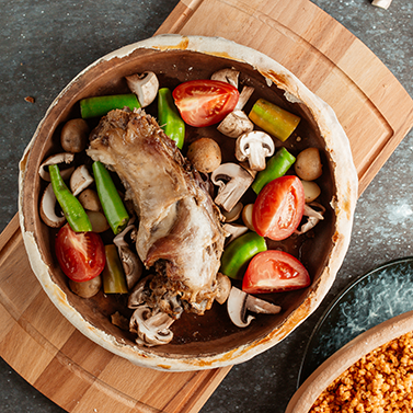 lamb-stew-pot-filled-with-fresh-mushrooms-potato-tomato-peppers